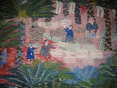 Detail of women weaving boxes from the centres of palm leaves