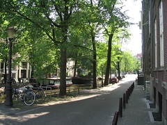 [Photo of shady canal in Amsterdam]